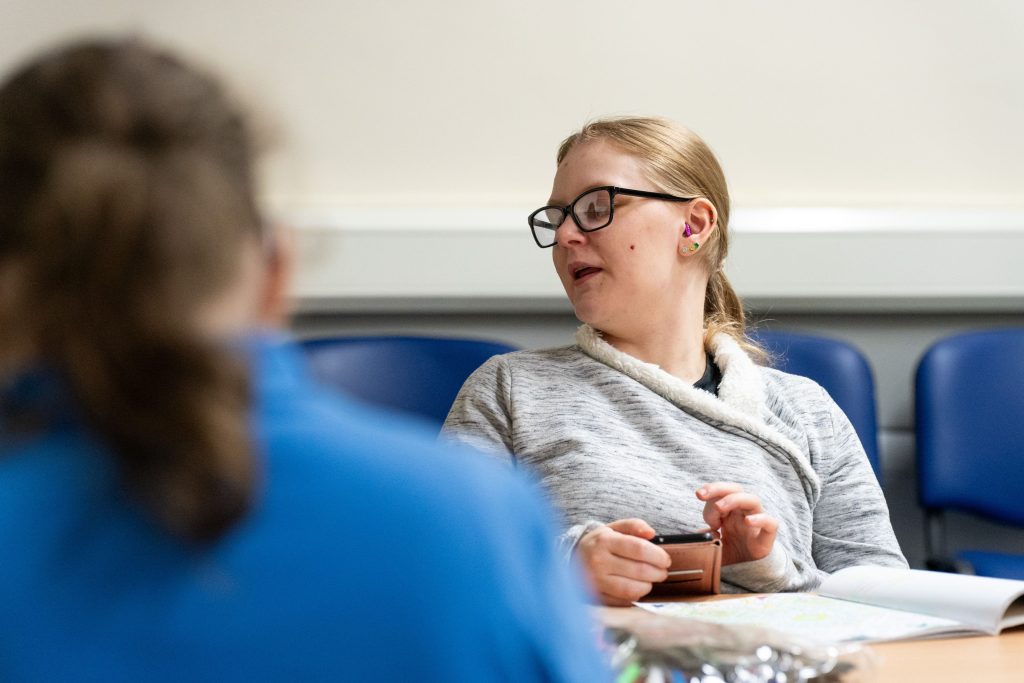 Two females chatting to each other at the Thursday club